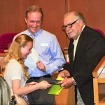 Wynn Childers, a student at Norton Park Elementary, receives her award from Mayor A. Max Bacon as Principal Doug Daugherty looks on.